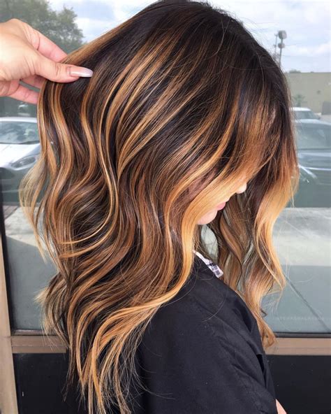 For an extra burst of golden goodness, lean more toward an amber-honey hue for your highlights. . Caramel highlights on brown hair